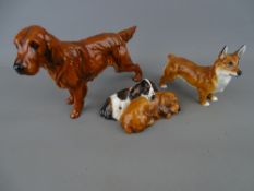 Three Royal Doulton dog figurines - a setter KN1055, a corgi HN2559 and a pair of sleeping