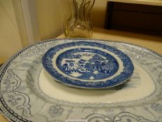 Haig & Haig vintage waisted whisky bottle and a Copeland platter