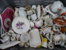 Crate of doll's house teaware and small cabinet collectables