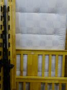 Light wood bed frame with a Sleepmaster Orthostar 4ft mattress