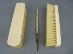 Pair of 19th Century dressing table brushes and a reticulated bone dip pen with Stanhope lens