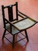 Child's seat with tray, possibly part of a high chair