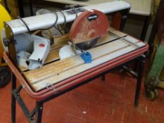 Rexon RTC230A disc cutter on stand, folding Workmate bench and a parcel of windbreakers and