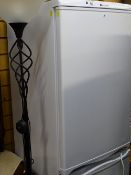 Hotpoint Aquarius upright fridge freezer and a black finished modern metal twist uplighter E/T