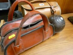 Two pairs of cased lawn bowls