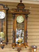 Good Vienna wall clock with carved sides, weights, pendulum and key included