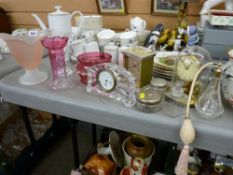 Two pieces of cranberry glass, Waterford crystal clock, a brass mantel clock by Koma with glass