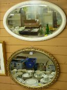 Fine oval framed bevelled wall mirror and another oval bevelled wall mirror