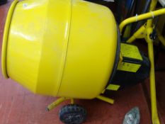 As new Belle Mini 130 mixer on wheels with a metal stand