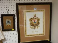 Framed commemorative silk of Victoria, 20 x 16 cms and a framed family crest