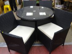 As new black rattan patio dining set of circular table and four chairs