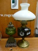 Brass based oil lamp with applied cameo reservoir and another iron based oil lamp