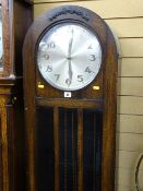 Oak cased dome topped longcase clock with triple weights and pendulum