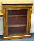 An antique inlaid and ebonized walnut single door pier cabinet, 76cms wide