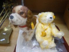 A small modern Steiff together with a modern Steiff spaniel dog