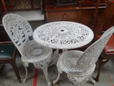 Painted white metal patio table and two chairs