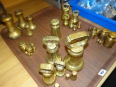 A collection of various vintage brass weights