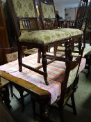 An Edwardian extending dining table with extra leaf on fluted corner supports together with six