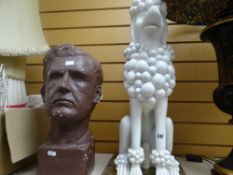 A large ceramic poodle together with a painted chalk bust of a male