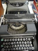 A vintage cased Underwood typewriter together with a similar vintage Remington Rand cased