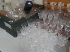 A good selection of cut glass items including four decanters, good quality drinking glasses, vases