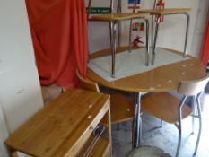 A modern circular breakfast table and matching chairs together with a small vegetable basket and