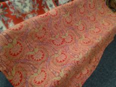 An antique red and green paisley patterned quilted throw / blanket, 203 x 173cms