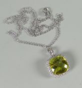 A modern 18ct white gold pendant and necklace, the pendant with cushion-cut green amethyst (