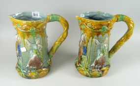 A pair of Majolica figural decorated large jugs