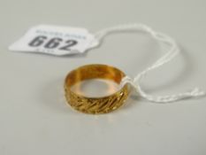 A bright cut 18ct yellow gold band ring, 2.7grams Please note: not tested, hallmarks, weights and