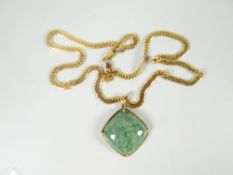 A modern 9ct yellow gold curb chain necklace 13gms attached with mineral pendant Please note: