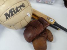 A pair of vintage leather child's boxing gloves, stamped Eton, together with a miniature model