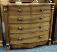 A nineteenth century mahogany chest of two short above three long drawers having flanking column