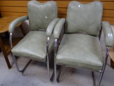 A pair of mid-century retro chrome supported upholstered armchairs with adjustable backs