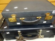 A vintage blue grey leather vanity case together with a mid-century Revelation suitcase