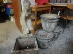 A reconstituted stone garden statue of Pandora together with four reconstituted stone garden pots