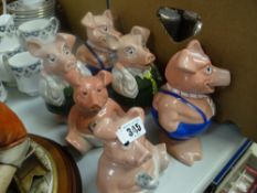 A collection of six Wade Natwest novelty piggies