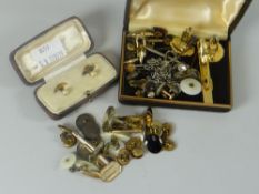 A parcel of gentleman's studs and cuff links in three containers