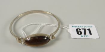 A Danish 95 silver and tiger's eye set bangle by Niels Erik From, 13grams Please note: not tested,