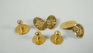 A set of vintage believed yellow gold gentleman's cuff links and studs (one stud missing), the