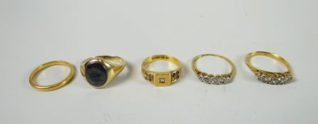 A 9ct yellow gold signet ring, a 22ct yellow gold wedding band, an 18ct yellow gold antique ring