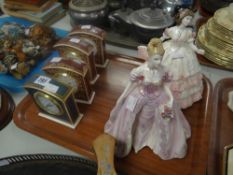 Two Coalport figurines together with a Royal Doulton 'Biltmore' pattern clock and three similar