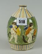 An early nineteenth century polychrome Pratt ware pottery flask moulded with harvesting angels to
