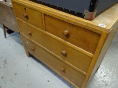 A vintage lightwood chest of two long and two short drawers