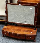 An antique mahogany toilet mirror with bow front stand with three drawers (distressed)