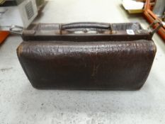 A vintage crocodile leather gladstone bag