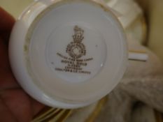 A parcel of Royal Doulton 'Royal Gold' patterned tea and dinnerware