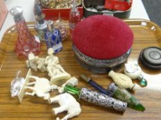 Collection of small collectables, scent bottles, carvings, white metal trinket box