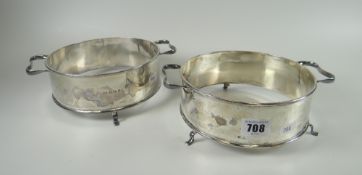 A pair of silver tripod casserole-stands of plain form with twin-handles, Birmingham 1917, 15ozs