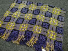A purple and mustard geometric Welsh blanket